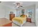 Bedroom with ceiling fan, two large windows, and light blue walls at 105 Somerley Dr, Garner, NC 27529