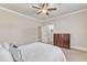 Neutral bedroom featuring a ceiling fan, light-colored walls, and a view of a closet at 105 Somerley Dr, Garner, NC 27529