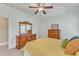 Bright bedroom featuring beautiful dressers, windows, and a ceiling fan at 105 Somerley Dr, Garner, NC 27529