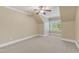 Upstairs bonus room with angled ceiling and bright window at 105 Somerley Dr, Garner, NC 27529