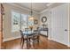 Cozy breakfast nook with hardwood floors, a round table, and large window with backyard views at 105 Somerley Dr, Garner, NC 27529