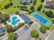 Aerial view of community pool, tennis court, and parking area at 105 Somerley Dr, Garner, NC 27529