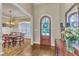 Inviting foyer showcasing hardwood floors, a wooden front door, and a glimpse into the dining room at 105 Somerley Dr, Garner, NC 27529