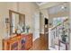 Bright foyer with hardwood floors, decorative furnishings, and a view of the living room at 105 Somerley Dr, Garner, NC 27529