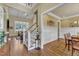Spacious foyer with hardwood floors, a staircase, and views into the living and dining areas at 105 Somerley Dr, Garner, NC 27529