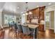 Gourmet kitchen with an island, granite countertops, stainless appliances, and a breakfast nook with backyard views at 105 Somerley Dr, Garner, NC 27529