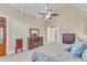 Comfortable main bedroom featuring a ceiling fan and an open door to the backyard at 105 Somerley Dr, Garner, NC 27529