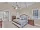 Stylish main bedroom with vaulted ceiling, fan, and beautiful furniture at 105 Somerley Dr, Garner, NC 27529