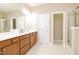 Bright bathroom with double vanity, shower, and tile flooring at 110 Elmsford St, Durham, NC 27707