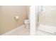 Close up of the toilet and shower in the bathroom at 110 Elmsford St, Durham, NC 27707