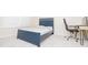 Bedroom featuring a blue bed with a desk and chair perfect for a study space at 110 Elmsford St, Durham, NC 27707
