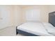 Bedroom featuring a blue bed and light neutral carpet at 110 Elmsford St, Durham, NC 27707