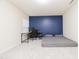 Bedroom featuring a desk and floor bed in front of an accent wall at 110 Elmsford St, Durham, NC 27707