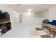 Large bonus room with carpet, television, and seating at 110 Elmsford St, Durham, NC 27707