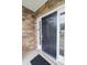 Elegant black front door framed by sidelights and a stone exterior, welcoming guests to the home at 110 Elmsford St, Durham, NC 27707