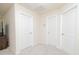Hallway with carpet and three doors at 110 Elmsford St, Durham, NC 27707
