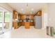 Spacious kitchen featuring stainless steel appliances, granite countertops, central island, and sliding doors to an outdoor patio at 110 Elmsford St, Durham, NC 27707