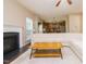 Welcoming living room featuring a fireplace, hardwood floors, and a seamless transition into the kitchen at 110 Elmsford St, Durham, NC 27707
