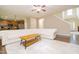 Spacious living room with hardwood floors, opening to a modern kitchen, perfect for entertaining at 110 Elmsford St, Durham, NC 27707