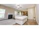 Bright living room with a cozy fireplace, hardwood floors, and a seamless transition into the kitchen at 110 Elmsford St, Durham, NC 27707