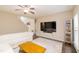 Spacious living room featuring a large TV, a display cabinet, and a staircase to the upper level at 110 Elmsford St, Durham, NC 27707
