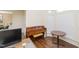 Office space with hardwood flooring, a piano, and a large window at 110 Elmsford St, Durham, NC 27707