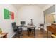 Office with hardwood flooring, multiple work spaces, and natural light at 110 Elmsford St, Durham, NC 27707