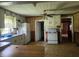 Functional kitchen with white cabinets, standard appliances, and a dining area at 111 Matthews Mill Pond Rd, Angier, NC 27501