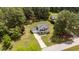 Aerial view of the home showing the well-manicured lawn, driveway, and surrounding trees at 11233 Jeffreys Ln, Wake Forest, NC 27587