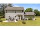 Spacious backyard with a patio dining set, perfect for outdoor gatherings and enjoying the serene environment at 11233 Jeffreys Ln, Wake Forest, NC 27587