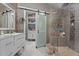 Stylish bathroom with a glass shower, modern fixtures, and ample storage space at 11233 Jeffreys Ln, Wake Forest, NC 27587