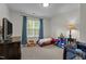 bedroom with car-shaped bed, TV, and crib, creating a playful and functional space for children at 11233 Jeffreys Ln, Wake Forest, NC 27587