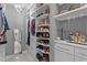 Large walk-in closet with custom shelving, drawers, and storage for accessories at 11233 Jeffreys Ln, Wake Forest, NC 27587