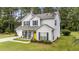 Well-maintained two-story home with an attached garage and a charming yellow front door at 11233 Jeffreys Ln, Wake Forest, NC 27587