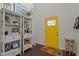 Stylish foyer featuring beautiful shelves, decor, and a bright yellow front door at 11233 Jeffreys Ln, Wake Forest, NC 27587
