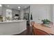 Bright eat-in kitchen featuring stainless steel appliances, gray cabinets, and large island at 11233 Jeffreys Ln, Wake Forest, NC 27587