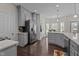 Bright eat-in kitchen featuring stainless steel appliances and gray cabinets at 11233 Jeffreys Ln, Wake Forest, NC 27587