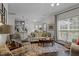 Open living room with view to kitchen and eat in area, filled with natural light at 11233 Jeffreys Ln, Wake Forest, NC 27587