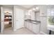 Bathroom featuring dual sinks with granite counters and white cabinets at 1211 Whispering Oak Ln, Durham, NC 27704