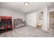 Bedroom with a crib, toys, and gray carpet at 1211 Whispering Oak Ln, Durham, NC 27704