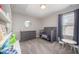 Bedroom with a crib, dresser, toys, and a round mirror at 1211 Whispering Oak Ln, Durham, NC 27704