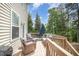 Relaxing deck area with outdoor seating and wooded views, perfect for entertaining or enjoying the outdoors at 1211 Whispering Oak Ln, Durham, NC 27704