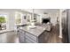 Open kitchen showcases gray cabinets, granite countertops and stainless steel appliances, creating a modern cooking space at 1211 Whispering Oak Ln, Durham, NC 27704