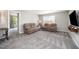Living room showcasing plush carpeting, neutral walls, and a comfortable sofa and loveseat at 1211 Whispering Oak Ln, Durham, NC 27704
