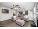Living room features an open floor plan with a fireplace and modern gray furnishings at 1211 Whispering Oak Ln, Durham, NC 27704