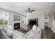 Living room featuring fireplace, media center, and lots of natural light from multiple windows at 1211 Whispering Oak Ln, Durham, NC 27704
