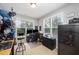 Bright office space featuring two windows, neutral walls, and an area for desk and safe at 1211 Whispering Oak Ln, Durham, NC 27704