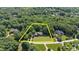 Expansive property with lush trees surrounding home with manicured lawn, offering privacy and serene setting at 12504 Bayleaf Church Rd, Raleigh, NC 27614