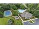 Comprehensive aerial of community amenities: tennis court, pool, clubhouse, playground, parking and manicured landscaping at 12504 Bayleaf Church Rd, Raleigh, NC 27614