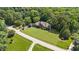 A sprawling property with mature trees surrounds this stately home creating a private retreat at 12504 Bayleaf Church Rd, Raleigh, NC 27614